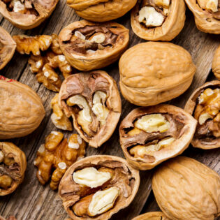 nuts-walnuts-dark-wood-background